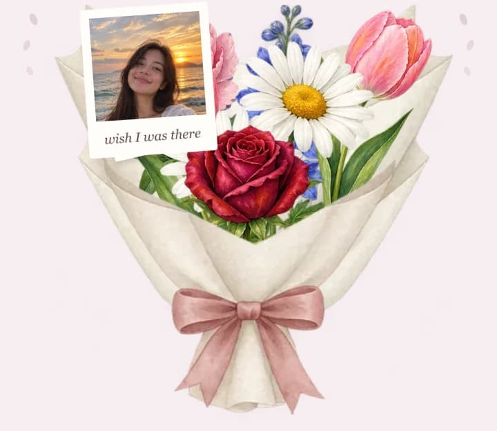 A wrapped bouquet of roses, daisies and tulips with a photo tucked in among the stems